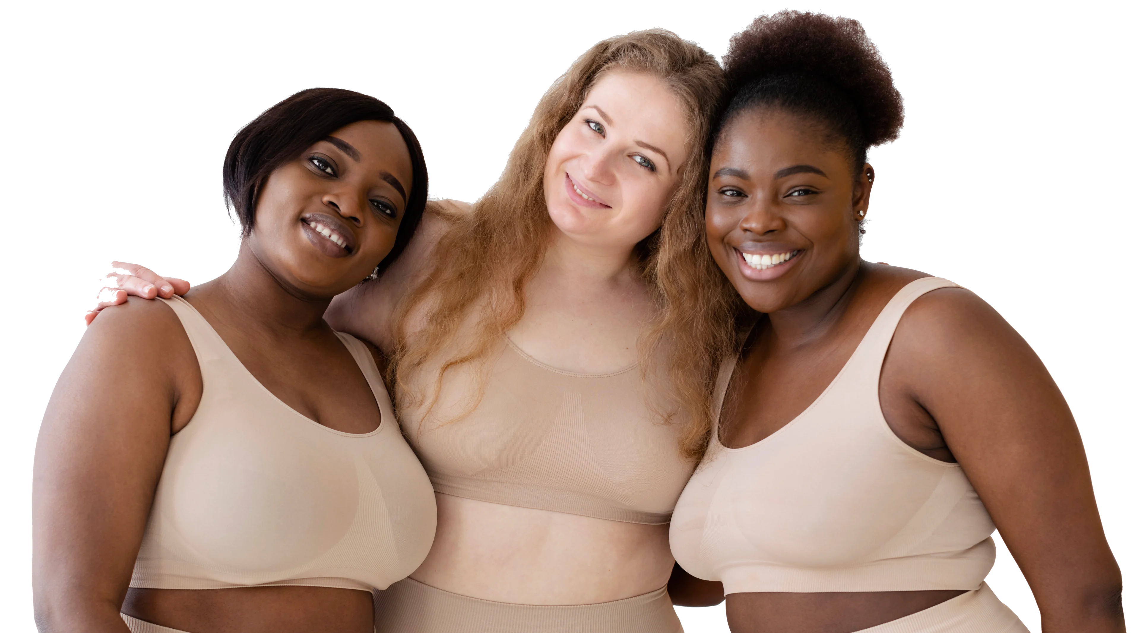 Three women in nude-toned bras smiling and embracing each other.